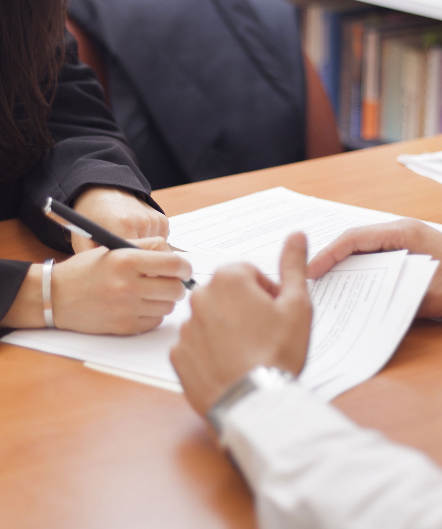 Woman Signing a Document